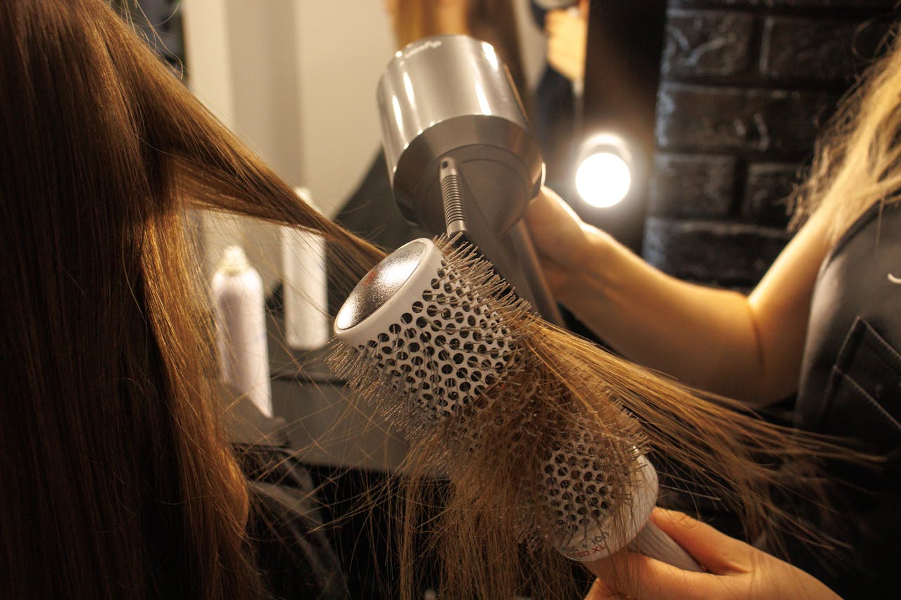 5. Excessive Heat Styling <p> Using heated styling tools like flat irons, curling irons, or blow dryers on a regular basis can weaken hair and lead to breakage. The intense heat from these tools can damage hair cuticles and make your hair more prone to falling out. To reduce the damage, limit the use of these tools and always apply a heat protectant when styling. Opt for air-drying your hair or using heat tools on lower settings to help maintain healthier hair. </p> :: Pexels