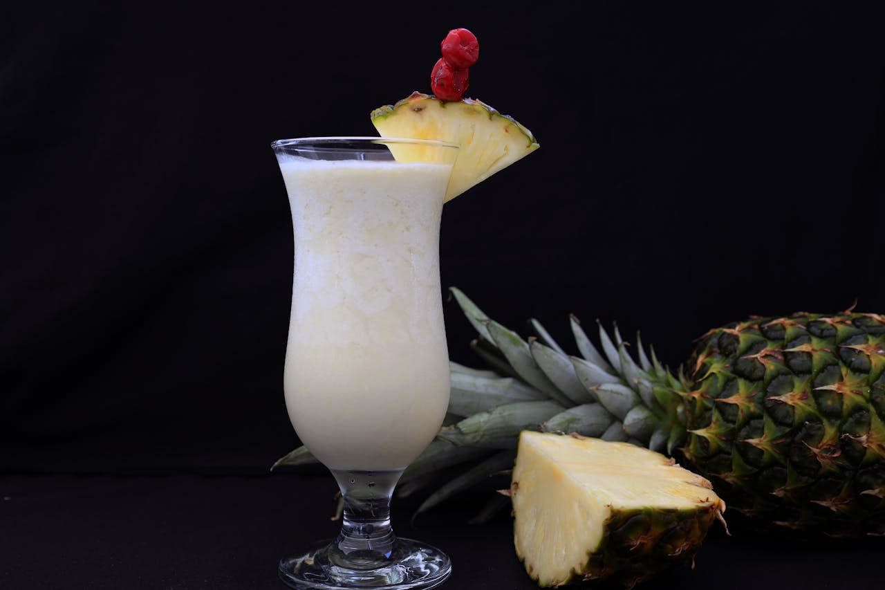 <p>1 cup pineapple juice</p> <p>1/2 cup coconut cream</p> <p>1/2 cup club soda</p> <p>Pineapple wedges for garnish</p> <p>Maraschino cherry for garnish</p> :: Pexels