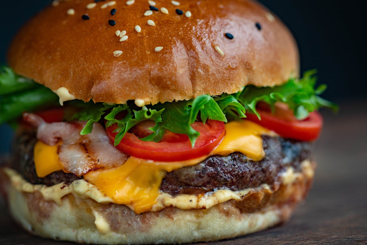 <p> There’s a reason the burger is an American classic, it’s delicious, satisfying, and endlessly customizable. From a basic cheeseburger to gourmet creations with all the toppings you can imagine, burgers are a food that can be enjoyed by anyone, regardless of their financial situation. Whether you’re eating a quick fast-food burger or savoring a juicy, gourmet version, a burger always hits the spot. It’s the perfect balance of flavors and textures, making it a food we’ll never stop craving. </p> :: Pexels