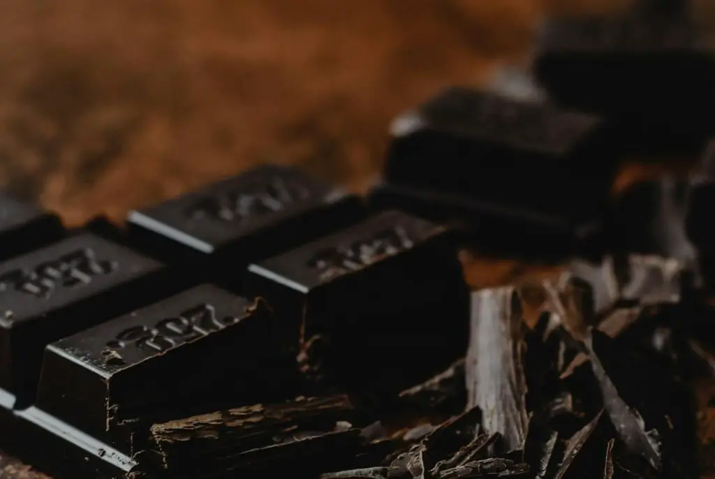 <p> Dark chocolate, particularly varieties with at least 70 percent cocoa, is rich in flavonoids that improve skin texture, enhance hydration, and boost blood flow to the skin. These antioxidants help protect against UV damage and reduce the appearance of wrinkles. Plus, dark chocolate contains magnesium, which reduces stress—a common culprit behind skin breakouts. Enjoy a few squares of high-quality dark chocolate as a guilt-free treat, melt it into a warm beverage, or add cocoa powder to smoothies and desserts for a nutritious boost. </p> :: Pexels