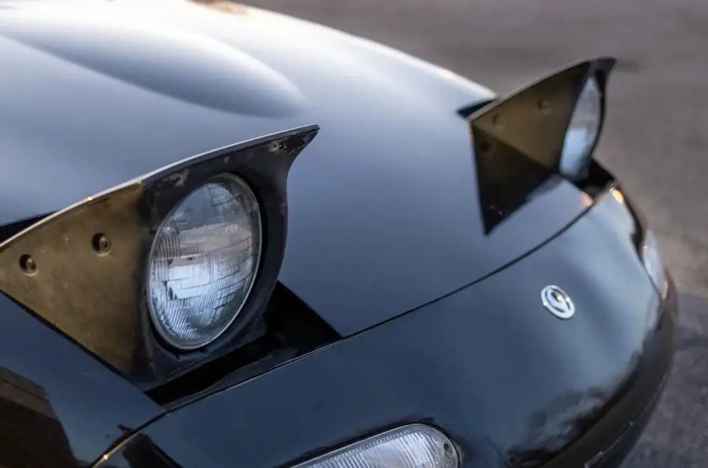 <p> Pop-up headlights were a signature feature of many sports cars, offering a sleek and aerodynamic appearance when closed and an unmistakable charm when activated. Found in iconic models such as the Chevrolet Corvette, Mazda RX-7, and Ferrari Testarossa, these headlights added a futuristic look to cars. However, evolving safety regulations and pedestrian protection laws contributed to their demise. The complexity of moving parts also made them more prone to mechanical failures, leading manufacturers to phase them out in favor of fixed LED and projector headlights. </p> :: www.thedrive.com