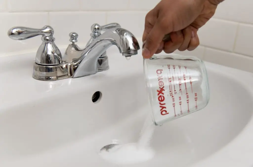 <p> A slow-draining sink or shower can turn into a plumbing disaster if ignored. Instead of reaching for expensive and toxic drain cleaners, try a simple homemade fix. Pour a cup of baking soda down the drain, followed by a pot of boiling water. For tougher clogs, add a cup of vinegar after the baking soda and let the fizzing action do its magic before flushing with more boiling water. This method clears gunk, eliminates odors, and prevents costly plumbing repairs—all without damaging your pipes. </p> :: The Spruce