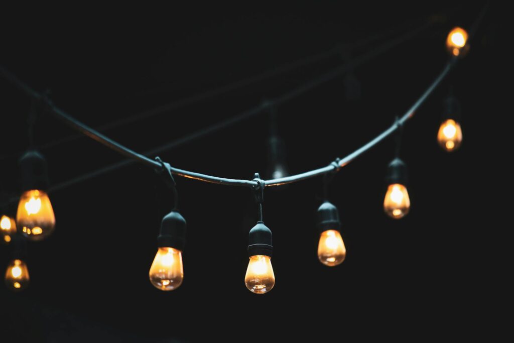 <p>Nothing sets the mood faster than soft lights. String lights are cheap, easy to install, and don’t need nails or screws. Use removable hooks or wrap them around curtain rods. The warm glow makes any room feel cozy and welcoming. String lights also photograph well, so your guests will want to share snaps. Fun fact: The first string lights were invented by Thomas Edison himself, making them both stylish and historic.</p> ::Pexels