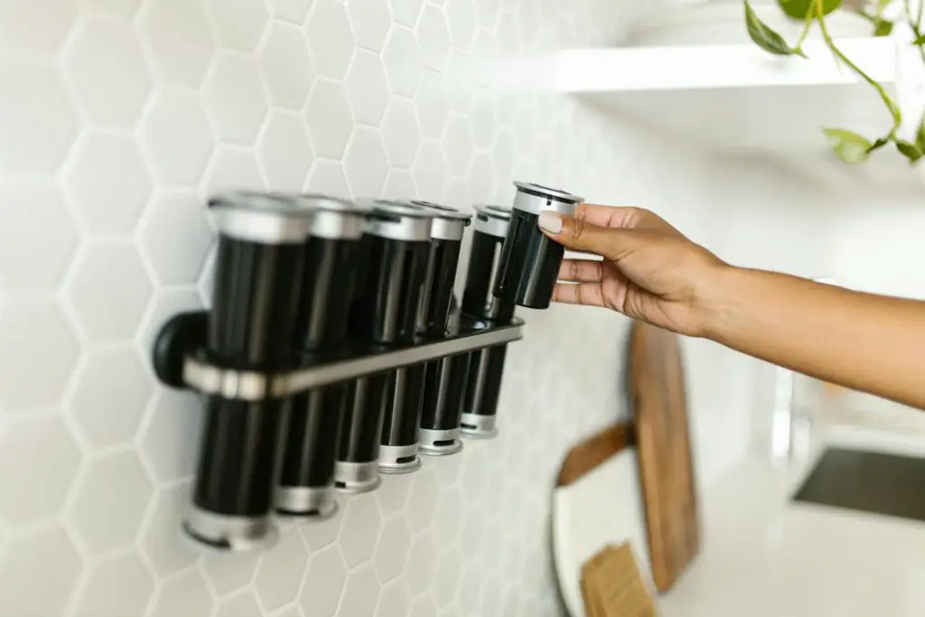 <p>Clear up counter space and give your kitchen a modern edge with magnetic spice racks. Stick them to your fridge or a metal board, and you’ve got both storage and style. Clear jars or labeled tins make your spices look organized and expensive. Plus, it keeps everything within reach while cooking. A neat row of spices in matching containers instantly upgrades your kitchen’s look. Fun fact: magnetic spice racks were first popularized by tiny homes where space is tight.</p> ::Pexels