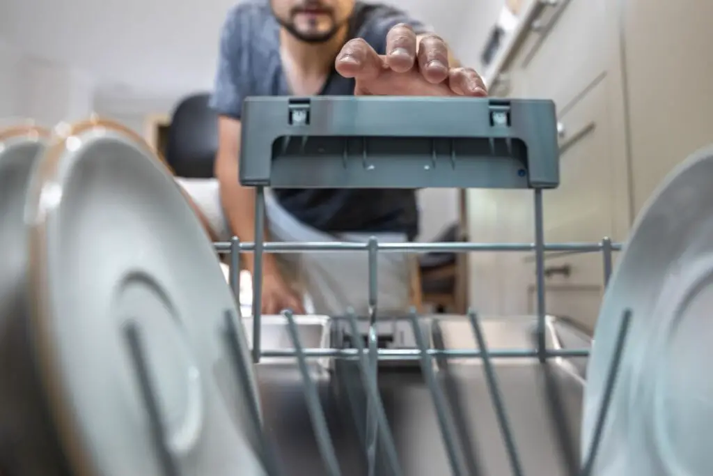 <p> Dishwashers save time and water but can consume a surprising amount of electricity, especially if you use the heated dry function. Heated drying works by raising the temperature to evaporate moisture from dishes, which uses much more energy than simply air-drying. Most modern dishwashers offer an air-dry option or an eco-mode that significantly reduces electricity use while still effectively drying your dishes. Another trick is to open the dishwasher door slightly after the cycle finishes, letting the dishes dry naturally and saving energy. These small changes add up over time and help reduce your power consumption without sacrificing convenience. </p> :: Freepik
