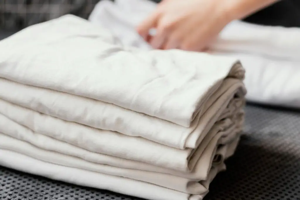 <p> It might seem like a good idea to store your winter wardrobe or extra linens in the garage during the off-season, but fabrics absorb moisture easily and can develop mold or mildew. Bugs and rodents also love nesting in soft materials, turning your cozy blankets into a breeding ground for pests. Plastic storage bins do not offer full protection either—humidity can still get in and damage your belongings. Use vacuum-sealed bags and store clothing and bedding in your closet, under-bed storage, or an interior storage room with regulated temperature. </p> :: Freepik