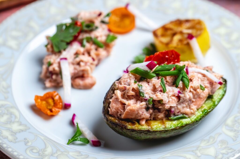 <p> This protein-packed snack is surprisingly easy to make, incredibly satisfying, and ready in just 10 to 12 minutes. Mix one can of tuna (preferably in water or olive oil) with a spoonful of Greek yogurt or mashed avocado, a splash of lemon juice, a pinch of salt, and any chopped veggies you like—onion, celery, or bell pepper all work well. Slice a ripe avocado in half, remove the pit, and scoop some of the flesh out to make room for your tuna salad. Fill each half with the tuna mixture, and top with a sprinkle of black pepper or red pepper flakes for extra flavor. These tuna-stuffed avocados are rich in omega-3s, protein, and healthy fats, making them a satisfying snack or light lunch that will keep you full and energized. </p> :: Freepik