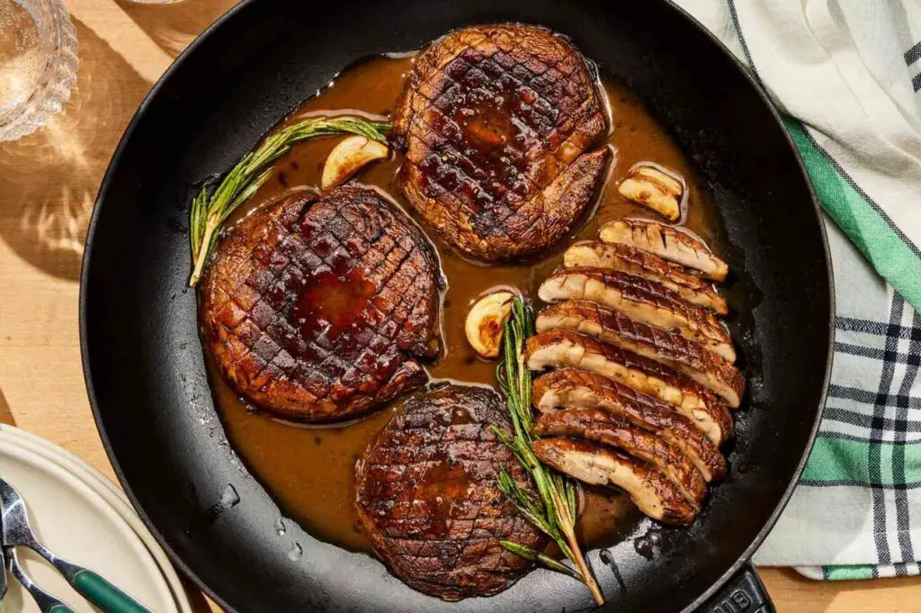 <p> Who says steak has to come from a cow? Thick, juicy portobello mushroom caps are the star of this recipe, offering a naturally meaty texture that’s perfect for grilling, roasting, or pan-searing. Brushed with olive oil, seasoned generously, and topped with homemade garlic herb butter (made with parsley, chives, and a pinch of lemon zest), these mushrooms soak up flavor like a sponge. Serve with roasted potatoes or over a bed of wild rice for a meal that feels elegant yet effortless. Rich in antioxidants, B vitamins, and selenium, mushrooms support immune and cognitive health—ideal for staying sharp and strong in your 50s, 60s, and beyond. </p> :: EatingWell