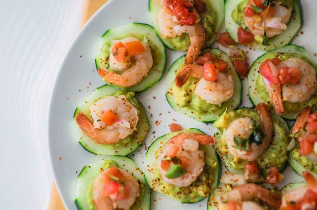 <p> If you’re looking for a fresh, low-calorie snack that’s big on flavor and crunch, cucumber hummus bites are a winning choice—and they only take about five minutes to assemble. Slice a cucumber into thick rounds and top each slice with a dollop of hummus. For added flavor and nutrients, sprinkle with paprika, sesame seeds, or chopped fresh herbs like parsley or dill. You can even add a slice of cherry tomato or a small piece of roasted red pepper on top for an extra pop. These bite-sized snacks are hydrating, rich in plant-based protein, and loaded with fiber, making them a refreshing option for hot days or busy afternoons when you need a quick boost without the bloat. </p> :: Pexels