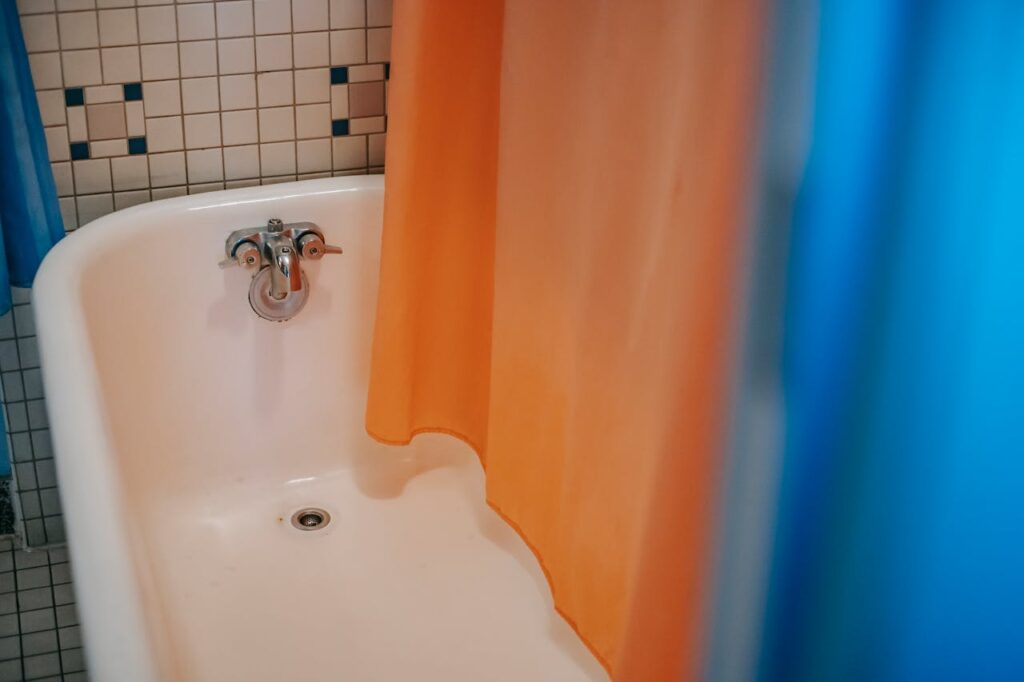 <p> Even if you keep your toilet scrubbed and your sink shiny, a mildewed shower curtain or clogged bathroom vent can undo all your effort. Shower curtains, especially fabric ones, tend to develop mold and soap scum over time, leading to unpleasant odors and unsightly stains. Meanwhile, your bathroom’s exhaust fan—designed to reduce humidity—can become clogged with dust and lint, making it both ineffective and unattractive. These are areas that guests will notice while using the bathroom, and they leave a lasting impression. To fix this, toss fabric curtains and liners into the washing machine every few weeks and let them air-dry. For the vent, a quick vacuum or wipe with a damp cloth can restore both function and appearance. </p> :: Pexels
