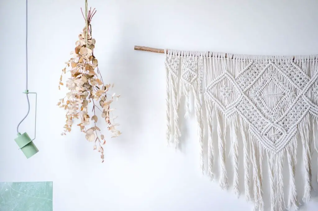 <p> A yarn wall hanging is a simple, inexpensive craft that adds a bohemian touch to any room. With just a few skeins of yarn in different colors and textures, a wooden dowel (or even a stick from your backyard), and a pair of scissors, you can create a stunning piece of wall art. Experiment with different knots, braids, and patterns to create a one-of-a-kind design. You can even add beads, feathers, or ribbons to customize it further. This craft is a relaxing project that lets you tap into your creative side while decorating your space. </p> :: Pexels