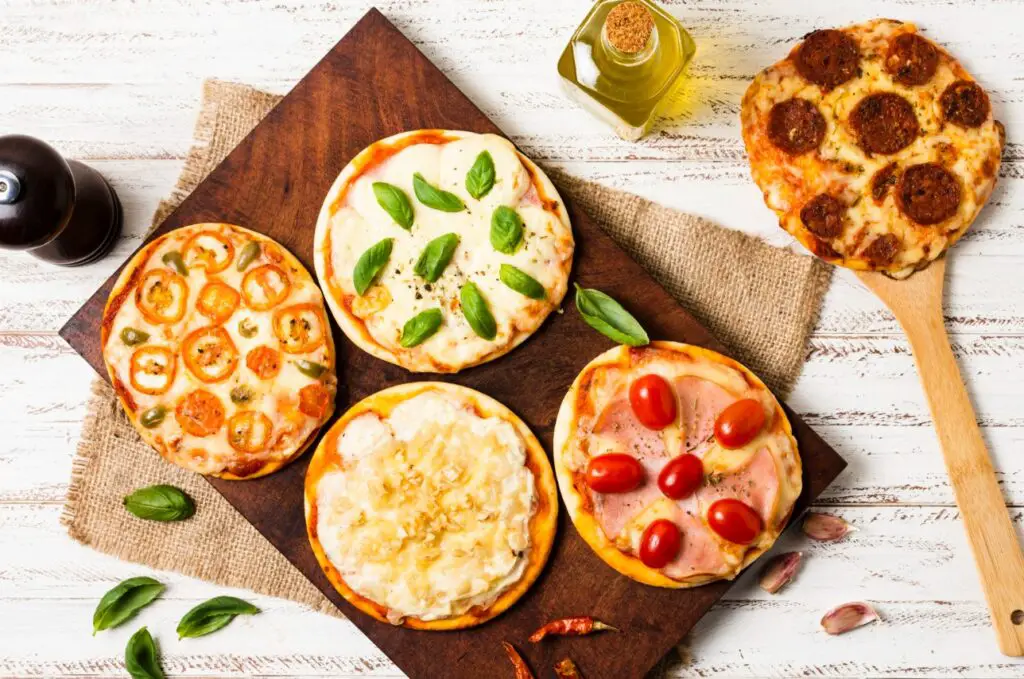 <p> Pizza night just got cheaper—and more fun. Use mini pitas or English muffins as your base, then let everyone build their own personal pizza with sauce, cheese, and toppings of choice. If you’re working with ultra-picky eaters, keeping it simple with just cheese or pepperoni is totally fine. Bake in the oven until the cheese bubbles and the crust gets crispy. It’s hands-on, delicious, and costs way less than delivery. </p> :: Freepik