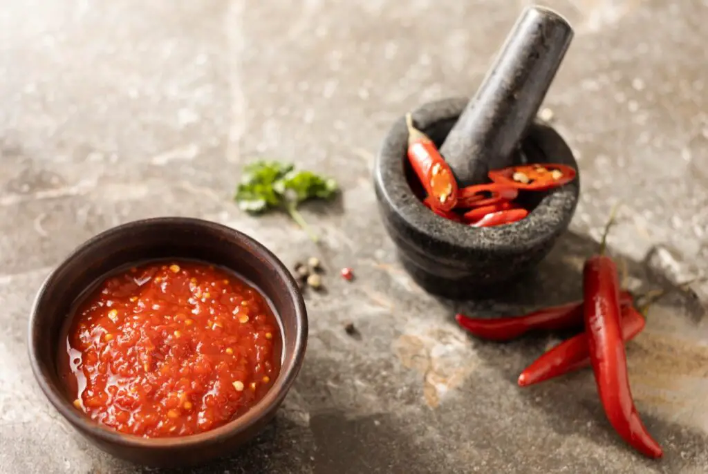 <p> Originally from Veracruz, Mexico, salsa macha is having a massive resurgence in 2025. This rich chili oil combines dried chiles, roasted nuts (like peanuts or almonds), garlic, and seeds in a blend that’s smoky, spicy, and just a little crunchy. Foodies are drizzling it over tacos, eggs, grilled veggies, and even vanilla ice cream for a sweet-heat combo. Its appeal? Intense umami and a kick that’s customizable based on your heat tolerance. It’s the condiment you didn’t know your pantry was missing — until now. </p> :: Freepik