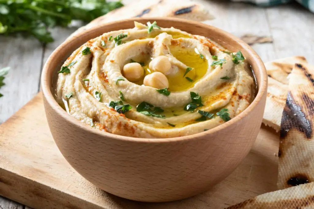 <p> Thirty years ago, hummus was a mystery to most Americans. Now? It’s a household name and a refrigerator staple. This creamy spread, made from blended chickpeas, tahini, lemon, and garlic, has Middle Eastern roots but all-American appeal. It’s protein-rich, high in fiber, and free of dairy and gluten—making it a hit across generations. Available in flavors from classic to spicy red pepper to chocolate dessert versions, hummus is a versatile dip, sandwich spread, or veggie companion. For boomers looking to snack smarter or reduce their processed food intake, hummus is a deliciously satisfying alternative to heavier dips and spreads. </p> :: Freepik