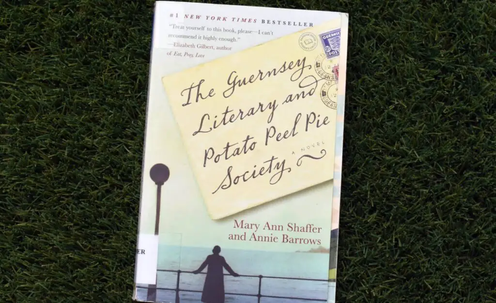 <p> Through charming letters between a London author and the residents of Guernsey, this historical novel tells the story of how a book club formed during World War II brought comfort and connection to its members. With endearing characters, a touch of romance, and historical tidbits, it’s a celebration of the written word. This book invites delightful discussions about community, resilience, and the magic that books bring into our lives. </p> :: Book Club Chat