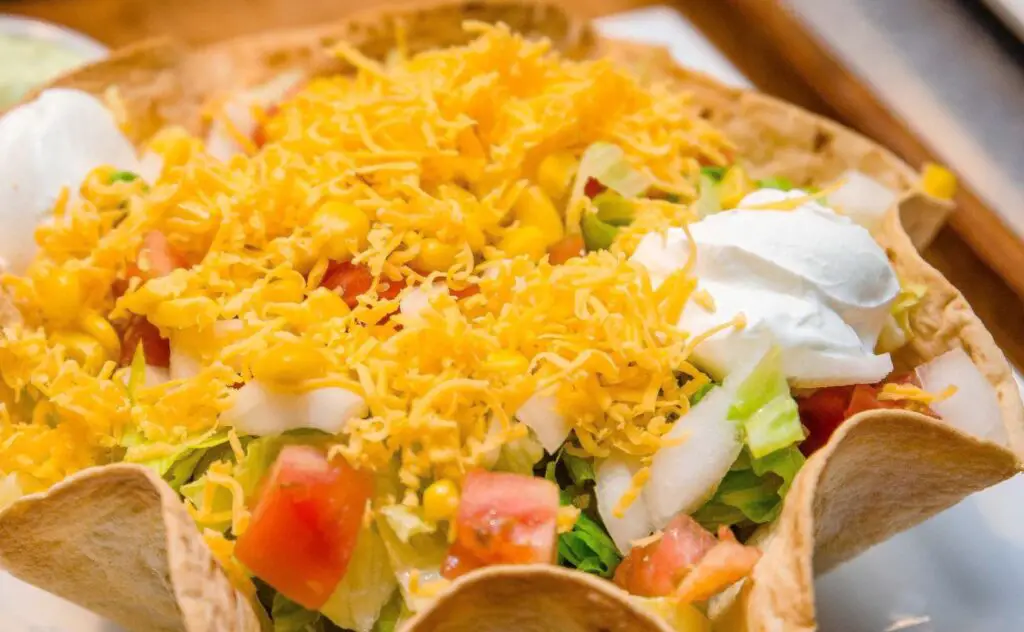 <p> Taco bowls are a budget-friendly, mess-free alternative to taco night that lets everyone customize their own plate. Start with a base of rice or tortilla chips, then offer toppings like seasoned ground beef or chicken, shredded cheese, lettuce, sour cream, and mild salsa. Keep spicy stuff optional and let each person build their dream bowl. It’s flexible, fun, and great for using up leftovers. </p> :: guides.brit.co
