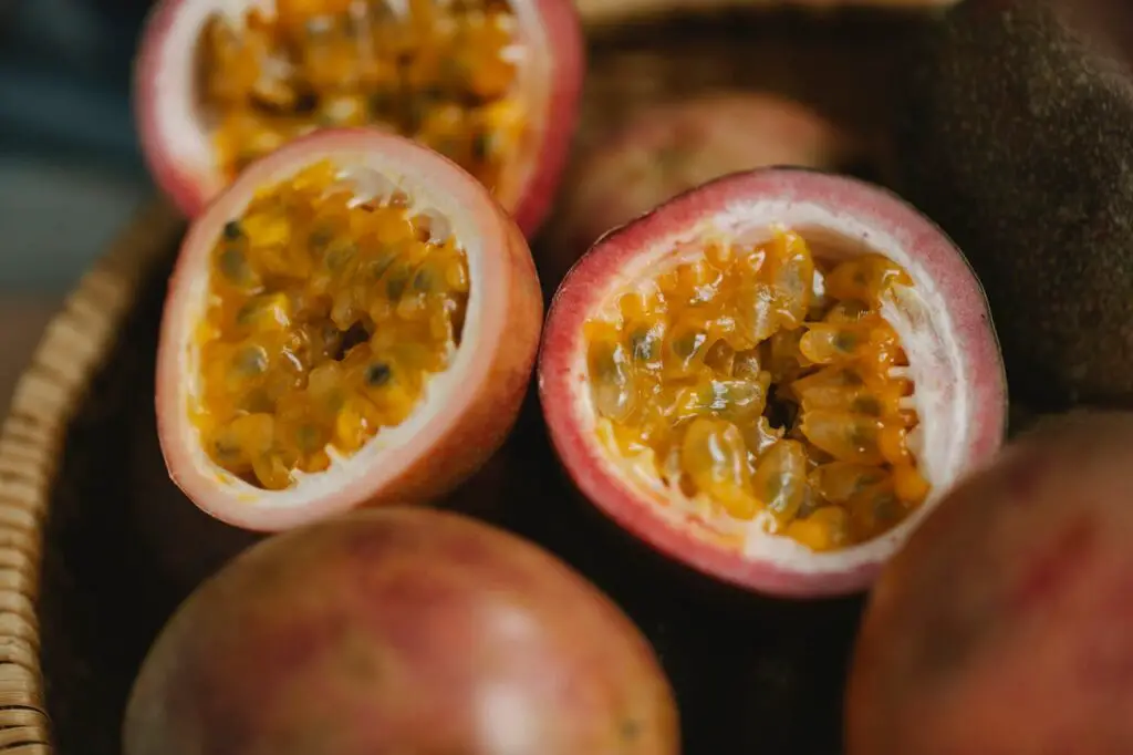 <p> Passion fruit might not be on your weekly grocery list yet—but it should be. This tropical fruit contains harman alkaloids, natural compounds believed to have mild sedative effects. It’s also high in magnesium and antioxidants. Fresh passion fruit can be scooped out and eaten by the spoonful, or you can opt for sugar-free passion fruit juice. Either way, it’s a tasty and effective addition to your nighttime wind-down routine. </p> :: Pexels