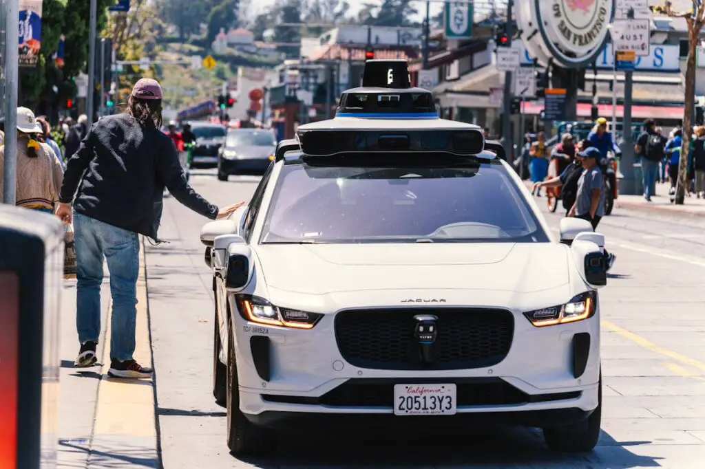 <p> Forget waiting for a human driver—robotaxis are rolling on real streets right now. Companies like Waymo (Google’s sibling) and Cruise have launched autonomous ride-hailing services in cities including Phoenix, San Francisco, Los Angeles, Austin, and Atlanta. Riders can summon a car through an app, hop in, and get driven across town—without anyone in the driver’s seat. Waymo recently celebrated over 250,000 rides a week, showing this tech is far from experimental. Tesla, meanwhile, is cautiously testing supervised robotaxis in Austin, blending automation with human oversight. While the idea of a driverless cab might feel unsettling, for thousands of riders, it’s become just another Tuesday commute. </p> :: Pexels