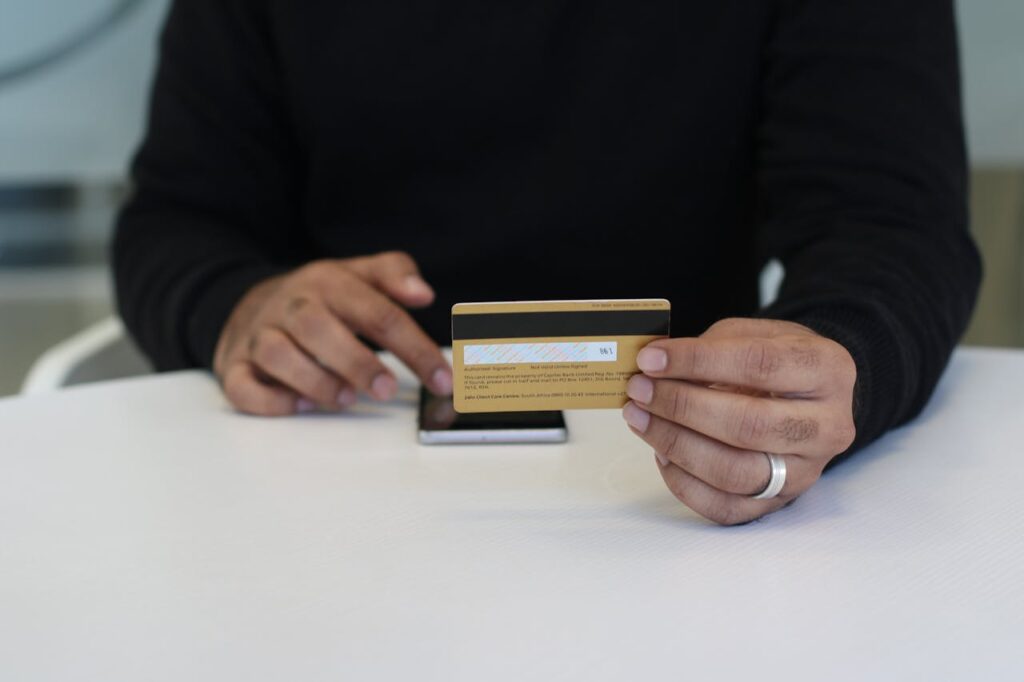 <p> We get it—the temptation to declutter your wallet by closing old credit cards is real. But before you chop up those plastic dinosaurs, think twice. Closing a credit account can shorten your average account age and lower your total available credit, both of which can hurt your score. Instead, keep older cards open and use them for occasional small purchases that you pay off right away. This keeps the account active and maintains your credit history. Older accounts are like the vintage wine of your credit report—the longer they’ve been around (and in good standing), the better they look. </p> :: Pexels