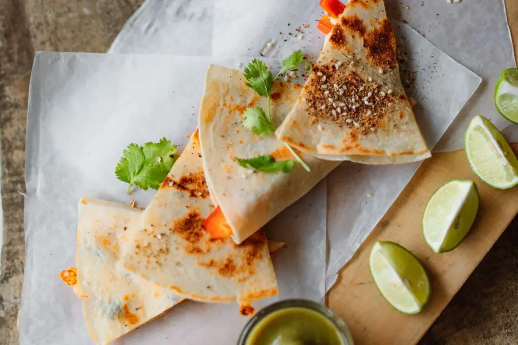<p> Quesadillas are fast, affordable, and totally customizable. Just place shredded cheese between two flour tortillas and cook in a skillet until the cheese melts and the tortilla crisps up. Cut into triangles and serve with sides like sour cream, salsa, or even applesauce. Add cooked chicken, beans, or veggies if your eater is a little more adventurous. Otherwise, plain cheese quesadillas are a beloved staple that never gets old. </p> :: Pexels