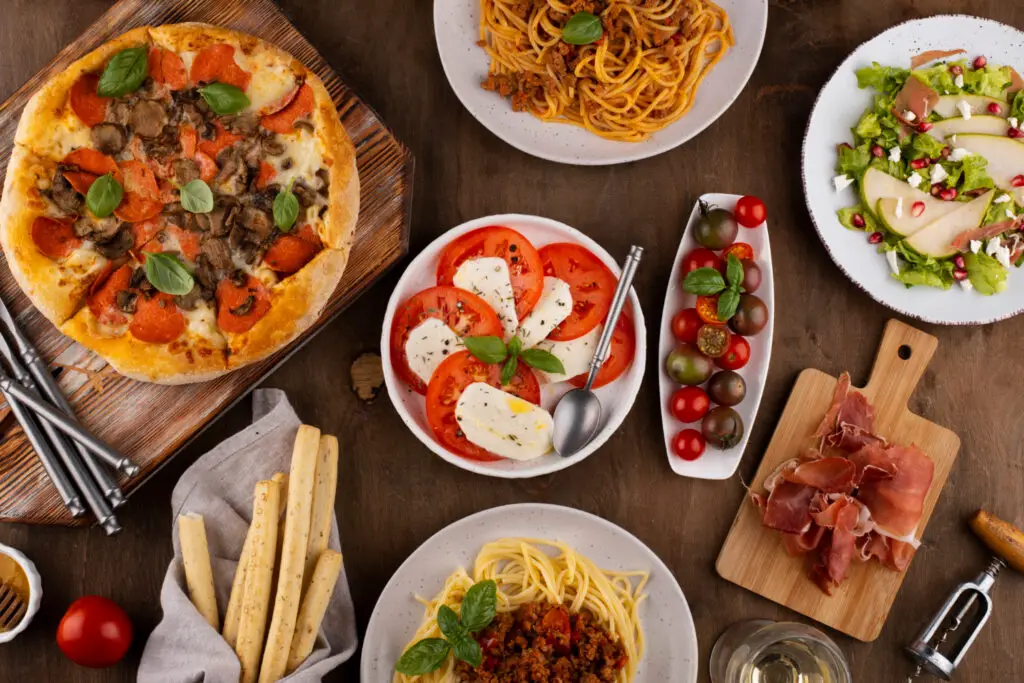 <p> If your heart beats faster at the thought of pasta, Bologna should be your next pilgrimage. Known as “La Grassa” (the fat one), this medieval city is the cradle of iconic dishes like tagliatelle al ragù (the real “Bolognese”), silky tortellini in broth, and rich mortadella. But Bologna’s food scene is more than just tradition—it’s the warmth of trattorias where locals gather, the scent of fresh pasta being rolled out in tiny workshops, and the joy of pairing a hearty dish with a sparkling glass of Lambrusco. Want to truly immerse yourself? Sign up for a pasta-making class with a local nonna and take home more than just souvenirs. </p> :: Freepik