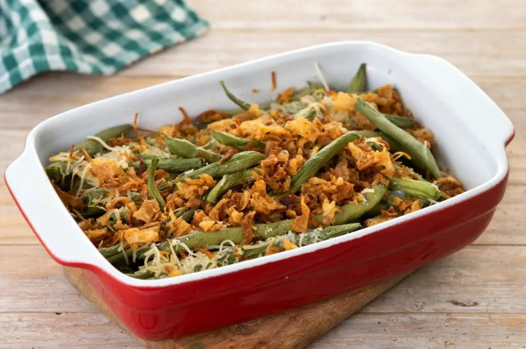 <p> No recipe says “comfort” quite like Green Bean Casserole. Born in the mid-1950s and skyrocketing to stardom during the ‘60s, it’s the classic side dish many boomers grew up eating at Thanksgiving and Sunday dinners. A creamy mixture of green beans, condensed mushroom soup, and those irresistible crispy fried onions on top—it’s easy to make and pure comfort on a plate. It’s also the kind of dish that sparks conversations around the table, as everyone debates whether it’s best with fresh or canned beans. </p> :: Freepik