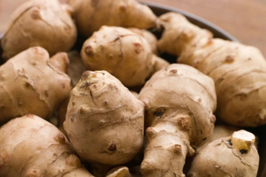 <p> Jerusalem artichokes—also known as sunchokes—are the secret weapon of gardeners who love unique veggies. These sunflower relatives produce edible tubers that taste nutty and slightly sweet, like a cross between a potato and a water chestnut. Plant them once in a sunny spot, and they’ll multiply generously underground, returning every fall with a fresh harvest. They’re low-maintenance and tolerate various soil conditions. Plus, their tall, sunflower-like blooms add cheerful beauty to your garden. Enjoy sunchokes roasted, pureed into soups, or sliced raw into salads for a crunchy surprise. Just be prepared for their reputation as the “fartichoke”—some people find them a bit… shall we say… gaseous! </p> :: Chatelaine