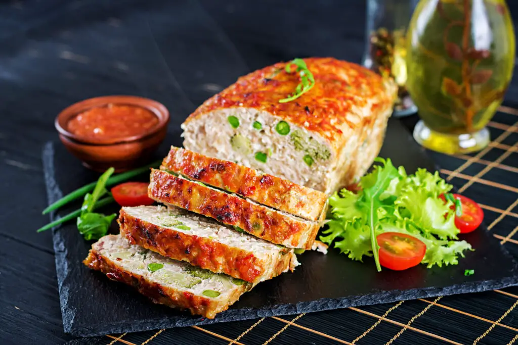 <p> A more budget-friendly take on fancy fish dinners, salmon loaf used canned salmon, eggs, breadcrumbs, and spices to create a mild and tender entrée. Served with a creamy sauce or just a lemon wedge, it was a clever way to stretch protein and make a midweek meal feel a little special. </p> :: Freepik