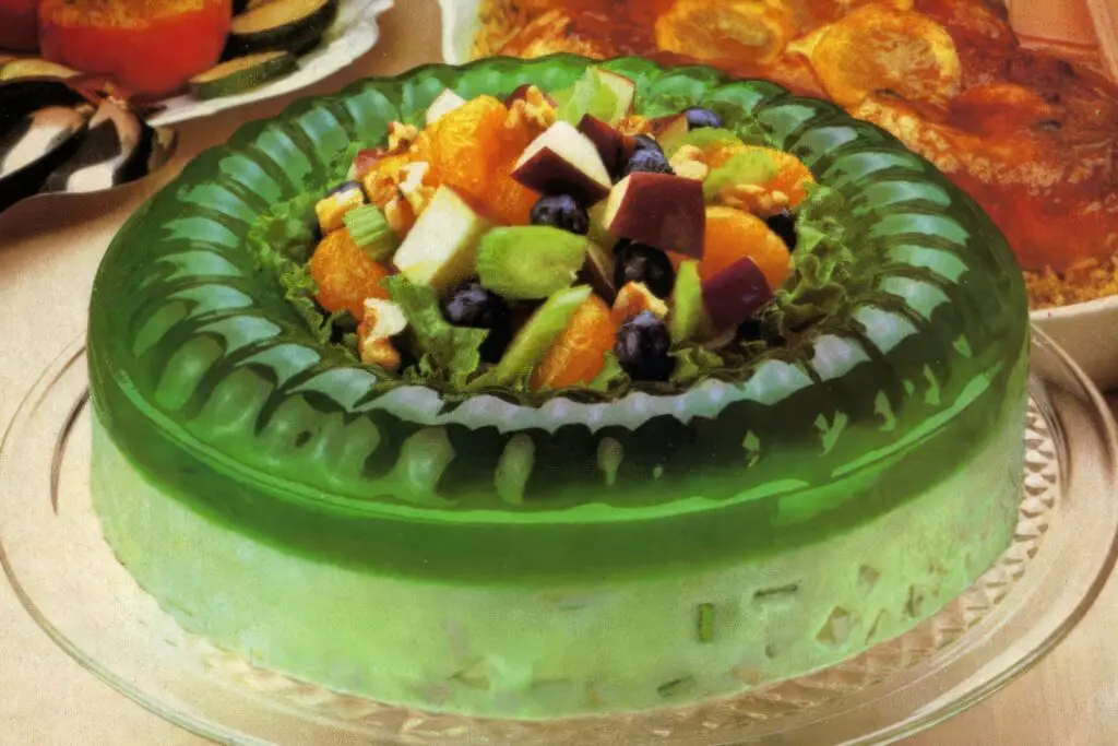 <p> Gelatin wasn’t just dessert—it was an art form. From rainbow-colored layers to molds filled with fruit, marshmallows, or even shredded carrots, Jell-O creations were the centerpiece of many holiday tables. They wiggled, they jiggled, and they sparked conversation—especially when someone dared to make a savory version with tuna. </p> :: Click Americana | clickamericana.com