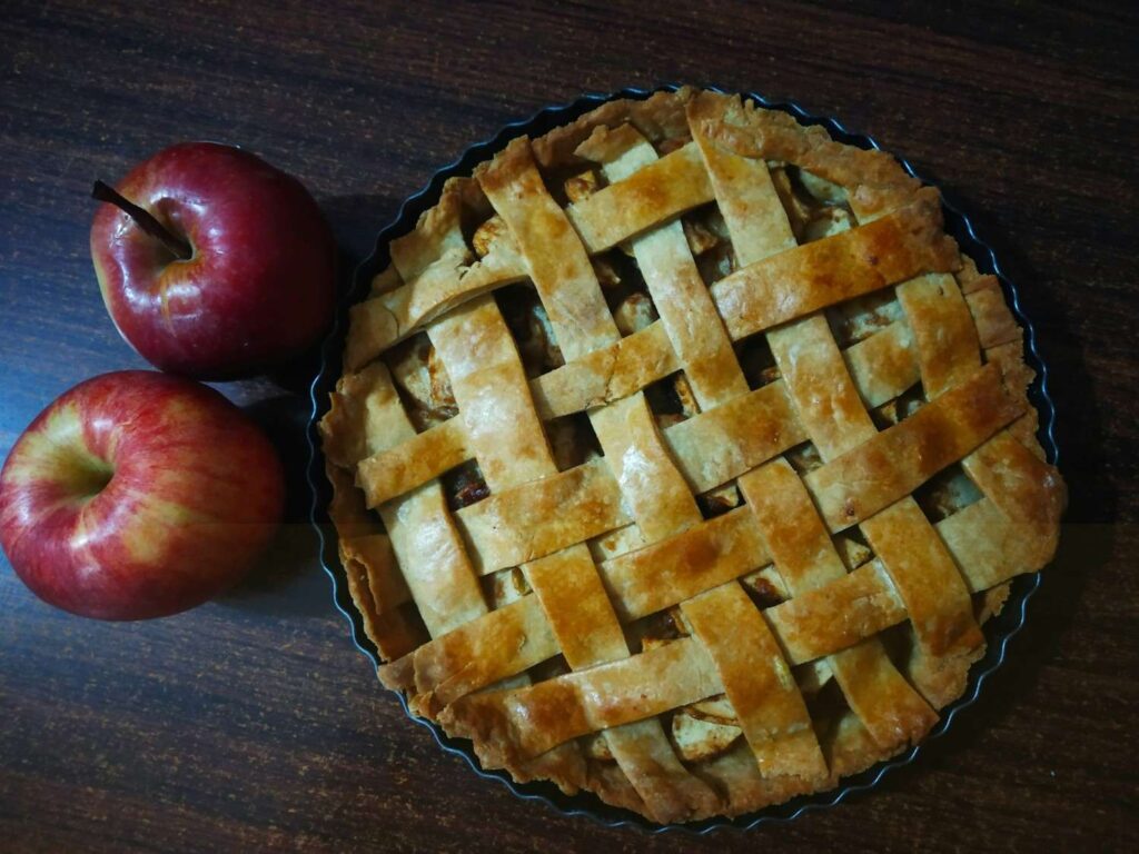 5. Homemade Apple Pie That Tastes Like Tradition <p> Apple pie is more than just dessert. It is a symbol of home, celebration, and family gatherings. Boomers often learned to make it by watching parents or grandparents peel apples, roll dough, and carefully arrange the crust on top.
The filling is simple, apples, sugar, cinnamon, nutmeg, and a touch of lemon juice. But when baked together, it creates something that feels special every time.
There is something almost ritualistic about making apple pie. It takes time and care, and that effort shows in every slice. Some families prefer it slightly tart, others like it sweeter, but the feeling it brings is always the same.
It often shows up during holidays or Sunday dinners, usually served warm with ice cream melting on top. It is not just dessert. It is a shared moment that brings people together. </p> :: Unsplash