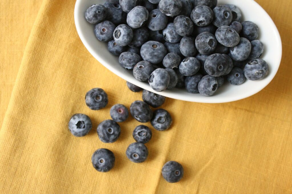 2. Blueberries <p> Blueberries are one of those foods that taste like a treat but work like a health supplement. For many boomers, they were simply part of a muffin, pancake, or cereal topping, but research shows these small berries are full of antioxidants called flavonoids. Flavonoids have been linked to better cognitive function and a reduced risk of memory decline as we age. In addition to supporting the brain, blueberries are rich in fiber, vitamin C, and vitamin K, which contribute to heart health and immunity. The great thing is that blueberries are convenient, especially frozen, and can be added to oatmeal, yogurt, or even eaten as a snack straight from the bag. Something as simple as sprinkling blueberries into your day can make a noticeable difference over time, and boomers have probably been doing it without thinking. </p> :: Pexels