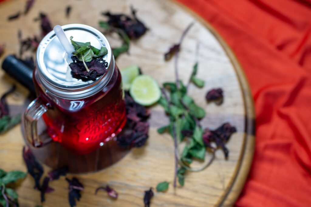 <p> Hibiscus tea is hard to miss because of its deep red color and bold, slightly tart flavor. It tastes a bit like cranberry juice, which already makes it more exciting than your average herbal tea. But what really makes hibiscus stand out is how it may support heart health. Some research suggests it can help lower blood pressure when consumed regularly. It is also rich in antioxidants, which help protect your body from everyday stress. If you enjoy cold drinks, hibiscus tea over ice can easily replace sugary juices or sodas without feeling like a downgrade. </p> :: Pexels